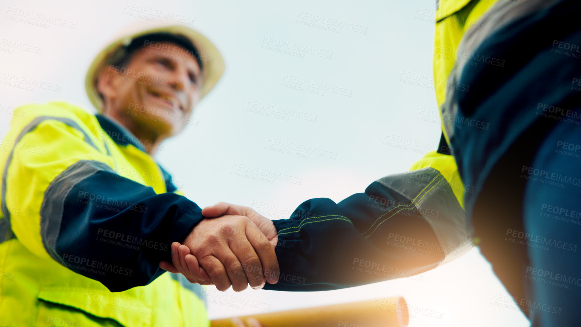 Buy stock photo Contractor, construction or handshake with happy man for architecture partnership or deal together. Person, builder or civil engineer shaking hands with smile for building agreement in site low angle