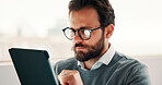 Tablet, reading and businessman in office with research for finance report with revenue growth. Digital technology, glasses and financial manager with feedback on investment proposal in workplace.