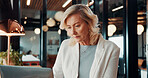 Reading, research and businesswoman with laptop in office, attorney and planning for case with info. Law firm, mature lawyer and person with tech for evidence, serious and lawsuit preparation on web