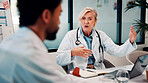 Laptop, meeting and doctors in office for research on medical diagnosis, treatment or surgery plan. Computer, discussion and team of healthcare employees with collaboration for procedure schedule.