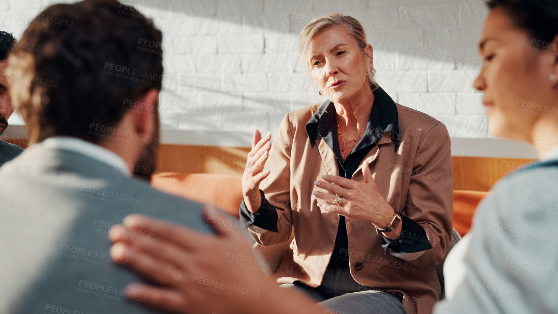 Buy stock photo Psychologist, support and therapy session with group in office, talk or employee counseling and help. Mental health, consultation and comfort for people with work anxiety, discussion and empathy