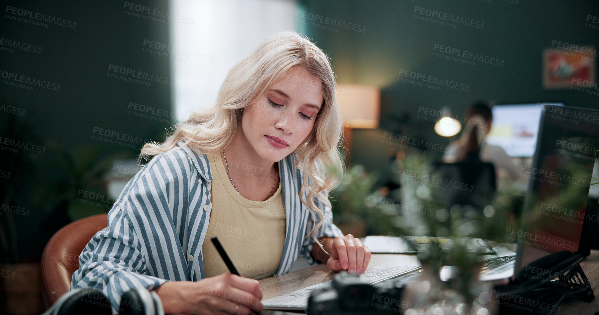 Buy stock photo Creative, woman and writing in office with laptop, review project and research for digital marketing. Female person, tech and coworking in agency with feedback, proposal and advertising campaign