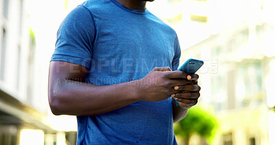 Buy stock photo Athlete, texting and hands with phone in city, communication and wellness update on social media app. Typing, message and person with mobile for chat, fitness and scroll health tips on website