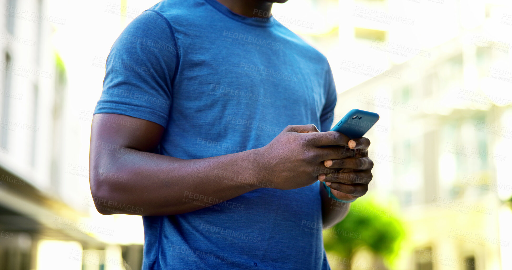 Buy stock photo Athlete, texting and hands with phone in city, communication and wellness update on social media app. Typing, message and person with mobile for chat, fitness and scroll health tips on website