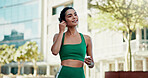 Thinking, athlete and woman with earphones in city, smile and streaming music for physical activity. Outdoor, fitness and happy person with tech for sound, listening and subscription for playlist