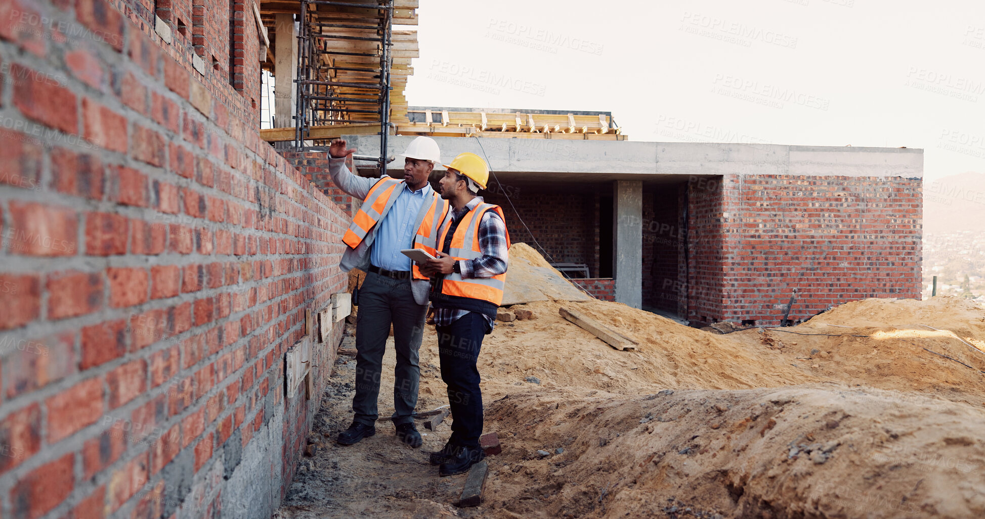 Buy stock photo Team, inspection and men with tablet at construction site, civil engineer and project update on web. Outdoor, architecture and people with tech for property development, talking and quality assurance