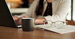 Laptop, hands and woman in home with online report, vision  and coffee for schedule communication. Glasses, remote work and consultant with person for freelance, discussion and project management