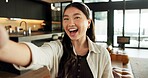 Laugh, selfie and portrait of Asian woman in home for social media, online post and profile picture. Happy, influencer and person with photograph for memory, update and live stream in apartment