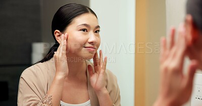 Buy stock photo Mirror, smile and woman in bathroom for skincare, grooming and dermatology for healthy skin and glow. Reflection, check and Asian person in house, hygiene and self care with cosmetics for beauty