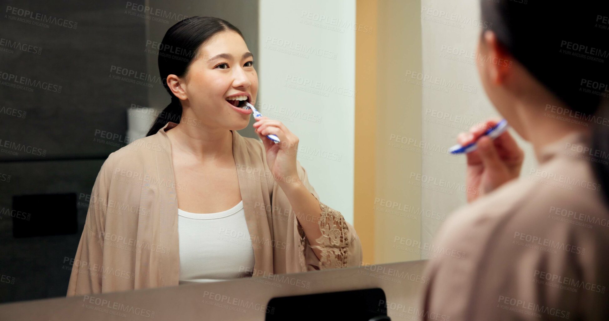 Buy stock photo Dental care, mirror and woman brushing teeth in bathroom at house for hygiene routine. Happy, toothbrush and Asian female person with cleaning mouth treatment for fresh breath or health in apartment.