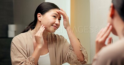 Buy stock photo Self care, mirror and woman in bathroom for skincare, happy or dermatology for healthy skin and glow. Reflection, home and Asian person with smile, hygiene and grooming with cosmetics for beauty
