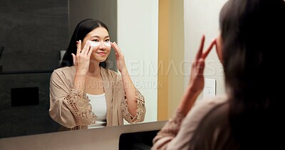 Buy stock photo Mirror, smile and woman with eye mask for skincare, hydration or self care with cosmetic in bathroom. Reflection, home and Asian person with patches, dermatology and reduced puffiness with treatment