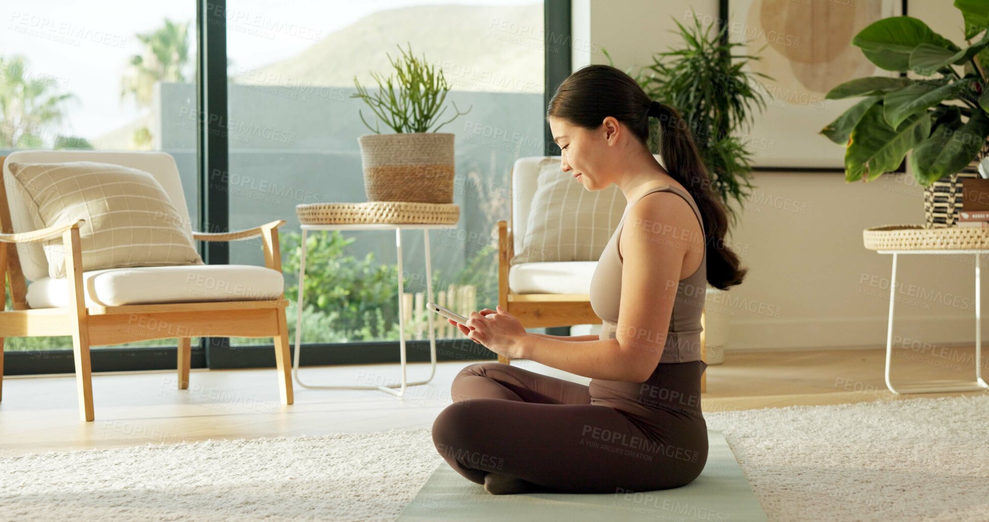 Buy stock photo Fitness, typing and woman with phone in home for social media, health app and wellness article. Apartment, online and person on cellphone for research, internet and website for pilates or exercise