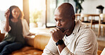 Couple, fight and ignore with argument in home for toxic relationship, divorce or separation. Frustrated, man and woman shouting with disagreement or stress on sofa for living room dispute in house