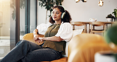 Buy stock photo Break, headphones and thinking with woman on sofa in home living room for me time or wellness. Listening to music, relax and weekend with person in apartment for audio, song or sound streaming