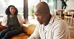 Couple, fight and conflict with argument in home for toxic relationship, ignore or separation. Frustrated, man and woman shouting with stress or disagreement on sofa for living room dispute in house