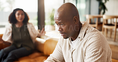 Buy stock photo Couple, fight and conflict with argument in home for toxic relationship, ignore or separation. Frustrated, man and woman shouting with stress or disagreement on sofa for living room dispute in house