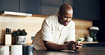 Smile, man or texting with phone in kitchen for online comment, text message or dating app response. Happy, black person and typing with mobile in home for status update, social media post or contact