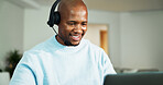 Laptop, headphones and black man in home for call center, crm or customer service with remote work. Mic, computer and African technical support agent with online consultation for advisory in house.