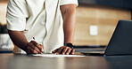 Hand, man and writing in home with document, application and agreement for finance loan. Male person, signature and laptop at house with paperwork, bookkeeping and compliance form for household audit