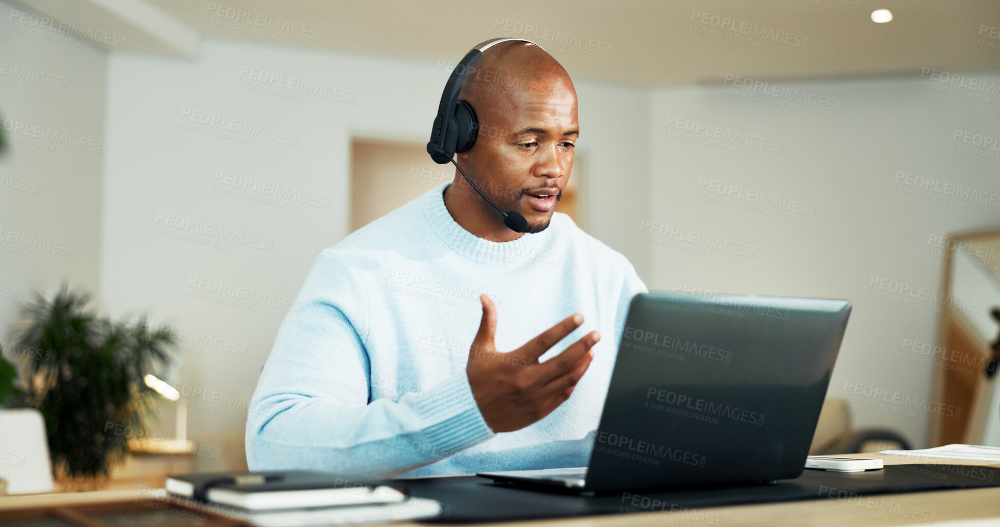 Buy stock photo Laptop, headphones and black man in house for call center, crm or customer service with remote work. Mic, computer and African technical support agent with online consultation for advisory in home.