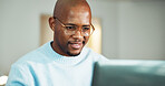 Review, smile or black man with laptop for remote work, accounting audit or internal risk evaluation. Reading, freelancer and financial controller with check for compliance policy, computer and home