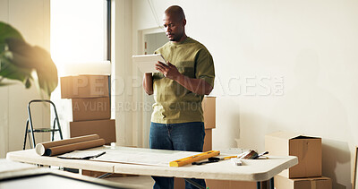 Buy stock photo Man, tablet and reading in new home for remodeling, interior planning and research for ideas. Black person, tech and blueprint in apartment for renovation, revamping project and app for inspiration