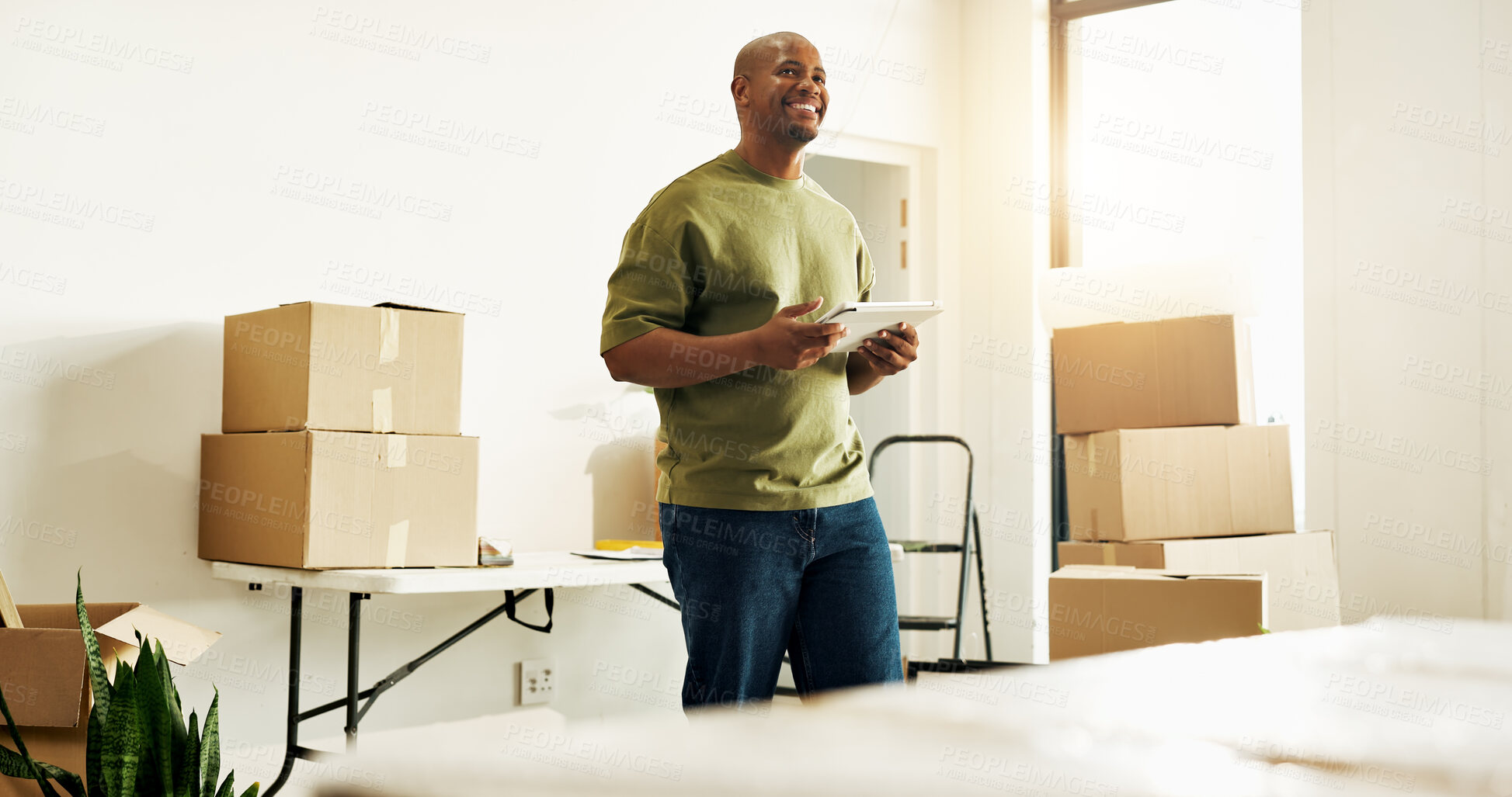 Buy stock photo Boxes, interior design and tablet with black man in new home for diy project or renovation ideas. App, inspiration and planning with happy homeowner in apartment for development or improvement
