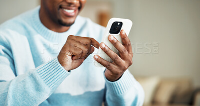 Buy stock photo Phone, hands and black man in home with texting, chatting or social media on mobile app. Happy, technology and African male person with cellphone for email, connectivity or contact in apartment.