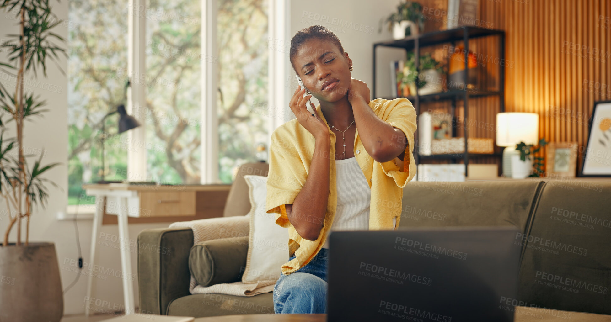 Buy stock photo Remote work, neck pain or black woman in home with phone call, sprain or joint issue with online feedback. Tired, tendinitis or freelancer with tech, discomfort or cervical strain with digital chat.
