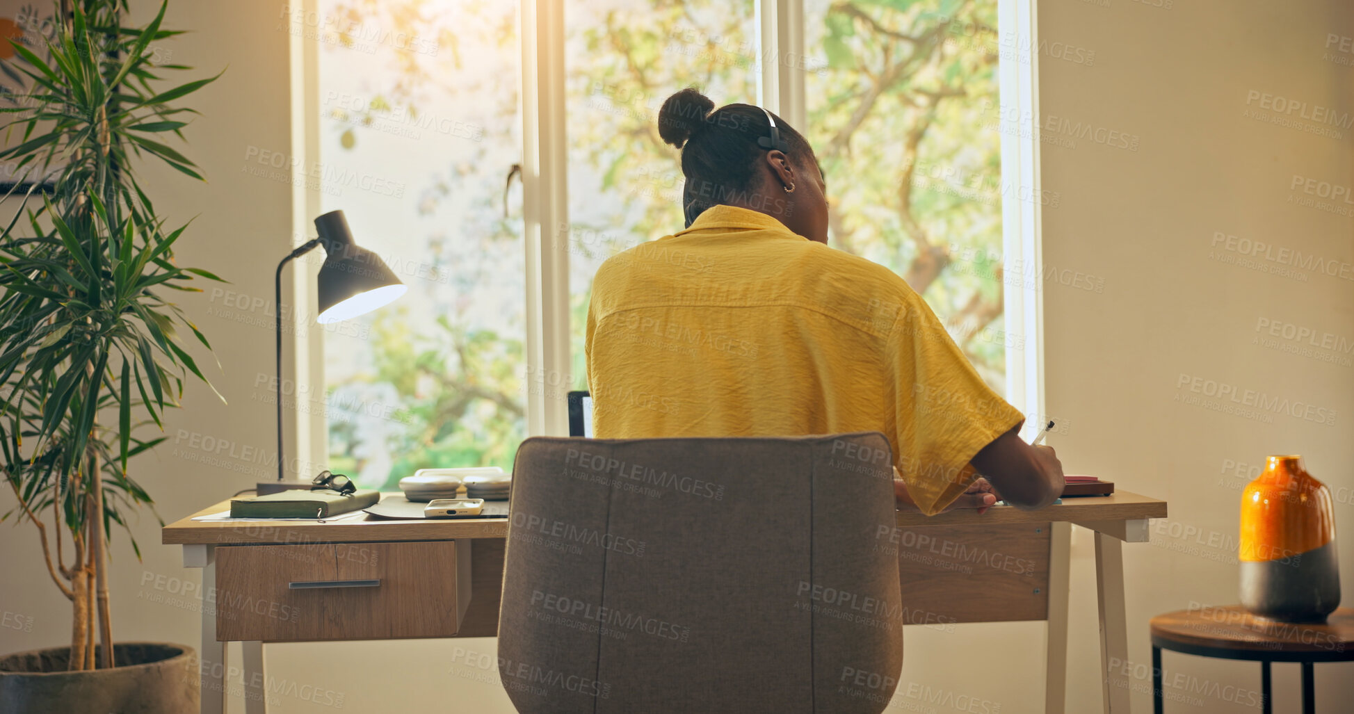 Buy stock photo Woman, helpline and agent writing in home office for query details, customer info and remote work. Tech, WFH and back of consultant with headset for CRM service, callback reminder or escalation notes
