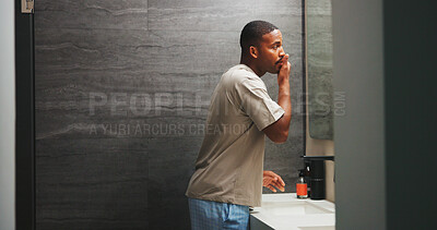 Buy stock photo Skincare, check or black man in bathroom with smooth skin, shine or facial care in morning routine. Space, inspection or male person in house with mirror, soft touch or grooming for getting ready