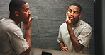 Skincare, check or black man in mirror with smooth skin,  dermatology or facial care in morning routine. Reflection, inspection or person in home with hygiene, soft touch or grooming in getting ready