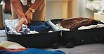 Woman, hands and packing suitcase for travel vacation with clothes, tasks and preparation for flight. Female person, holiday and getting ready in home with luggage, apparel or outfit for tourist trip