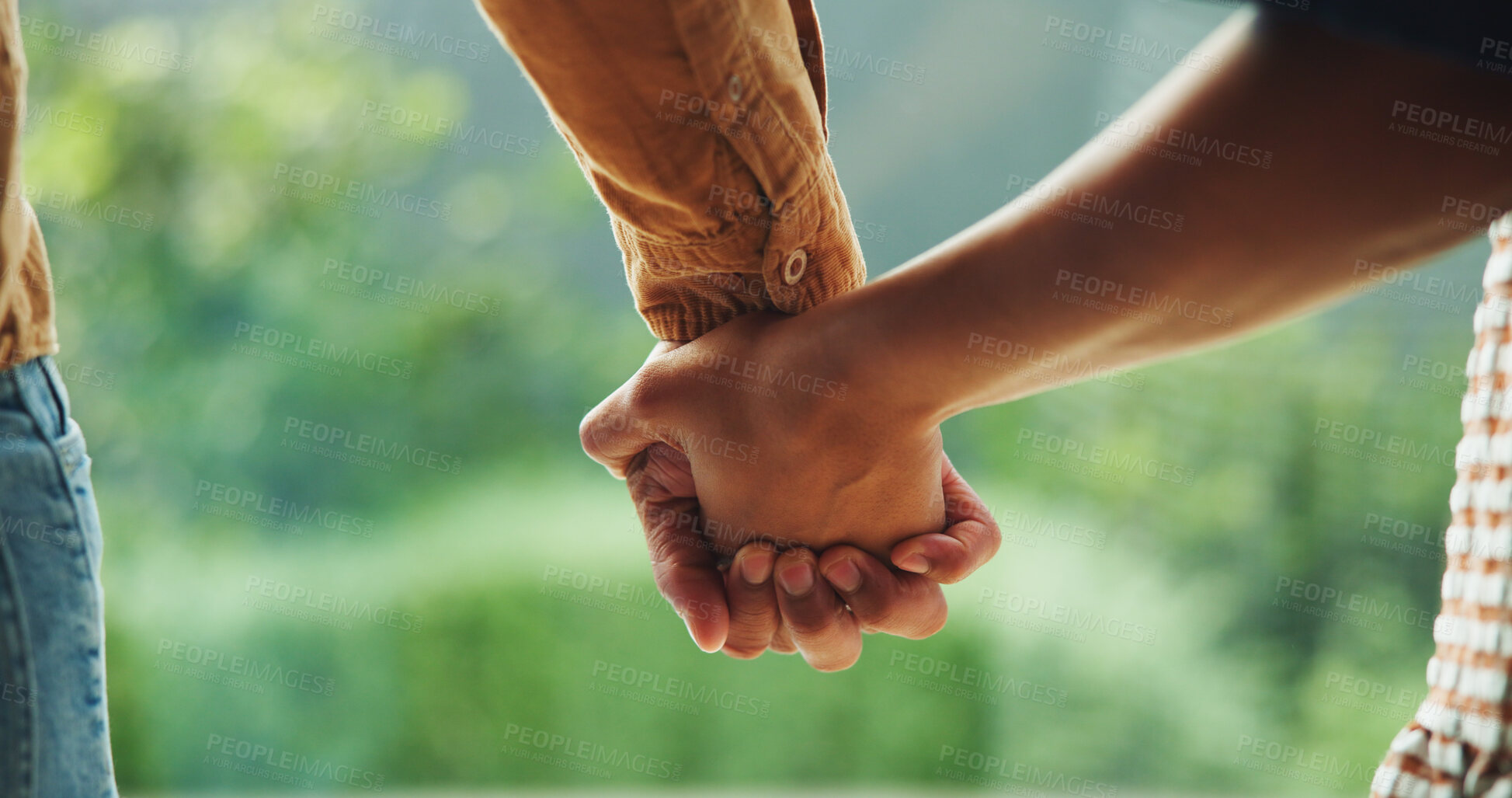 Buy stock photo Love, couple and holding hands outdoor for care, relationship wellness and safety together. Connection, man and woman with security at park for support, trust and commitment to partner with loyalty