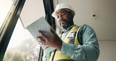 Buy stock photo Tablet, black man and construction worker on site with research for building development. Technology, email and mature civil engineer with feedback for renovation, repairs or maintenance from below.