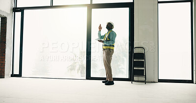 Buy stock photo Tablet, construction and black man in building for inspection, evaluation and safety compliance. Civil engineer, architecture and person with tech for planning, renovation project or review space