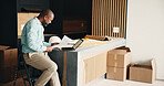 Black man, new home and document for remodeling, layout design or real estate maintenance. Mature person, paperwork or laptop for architectural planning in house with property renovation or upgrade