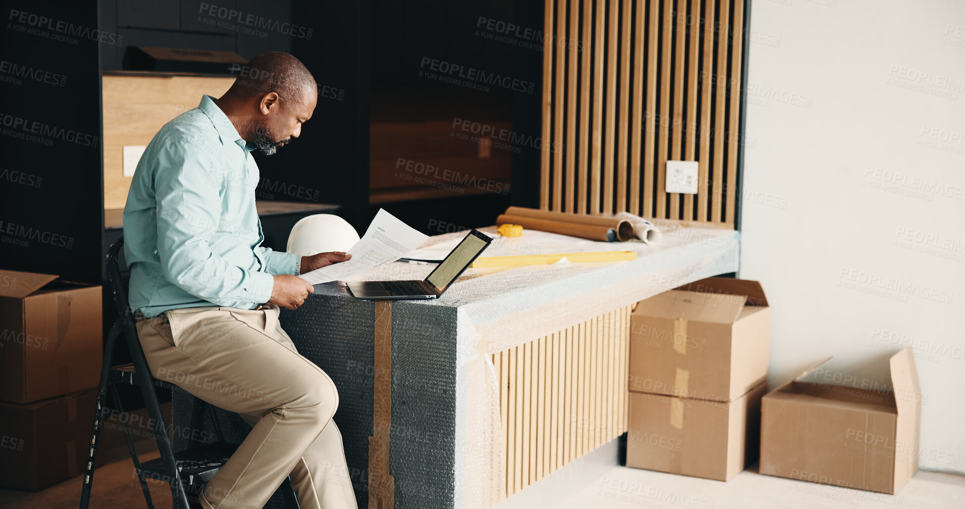 Buy stock photo Black man, new home and document for remodeling, layout design or real estate maintenance. Mature person, blueprint or laptop for architectural planning in house with property renovation or upgrade