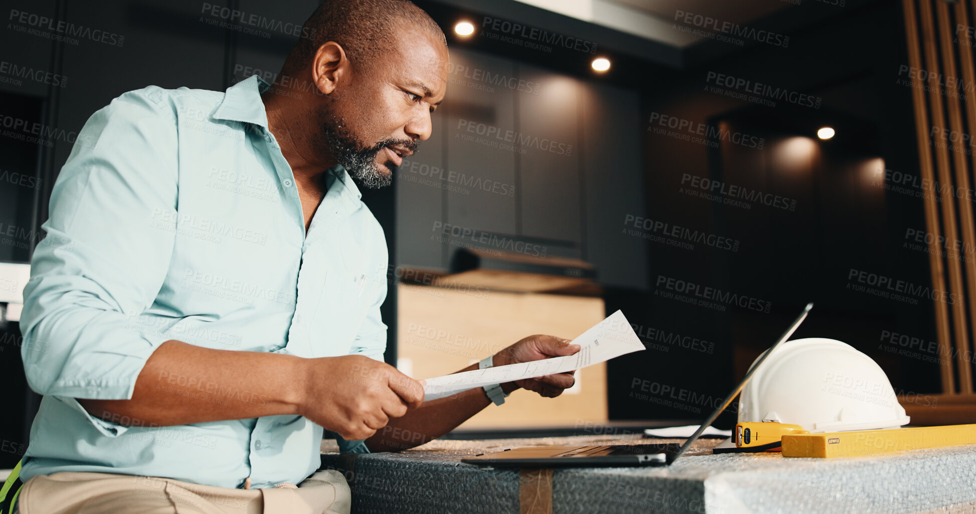 Buy stock photo Black man, new home and document for remodeling, floor plan or real estate maintenance. Mature person, blueprint or laptop for architectural layout in house with property renovation or upgrade