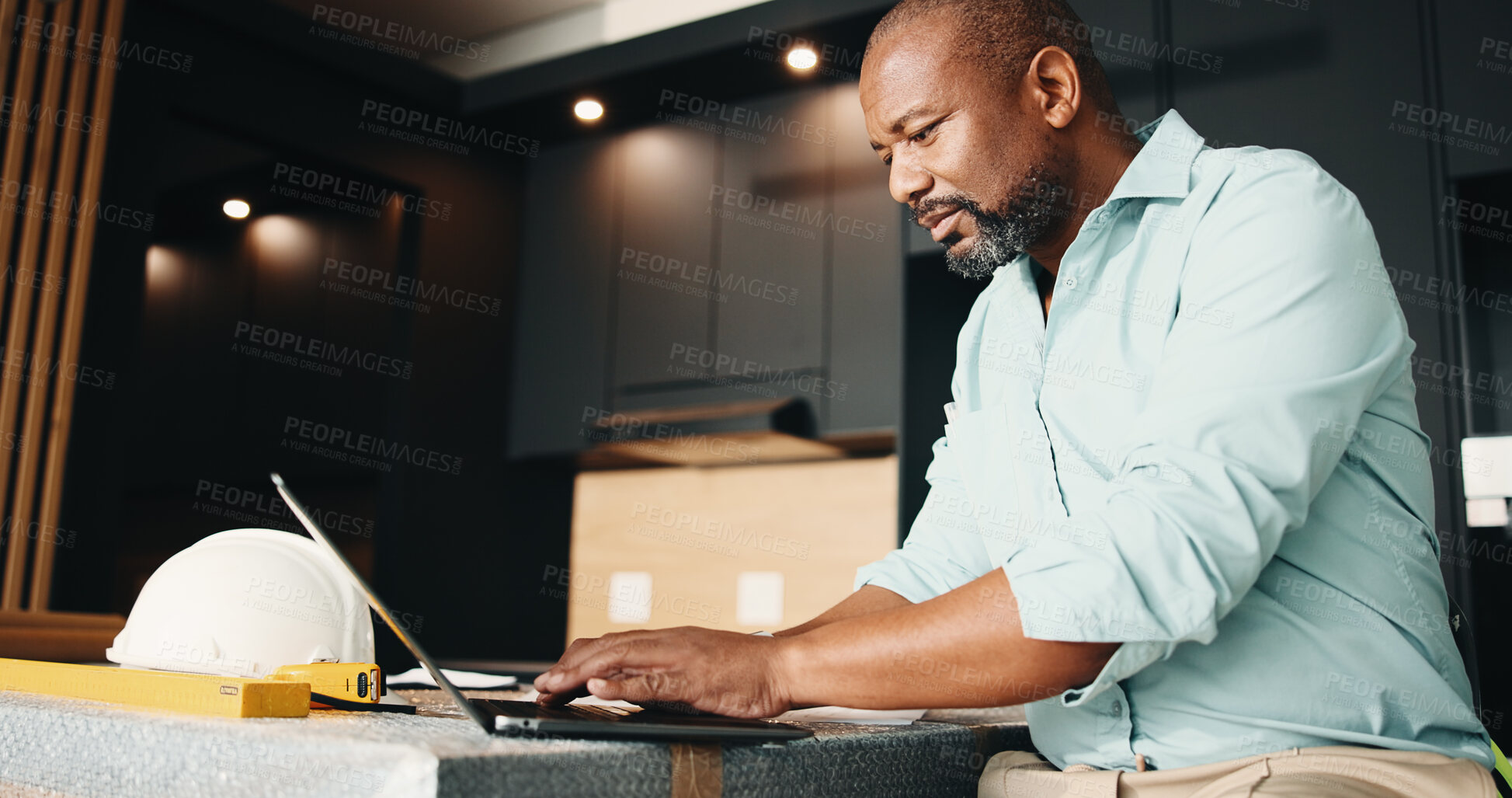 Buy stock photo Black man, new home and laptop for renovation, research design or real estate maintenance. Mature person, typing and tech for architectural planning in house with property remodeling or upgrade