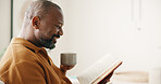 Chill, coffee or black man in home with reading book, calm moment or literature hobby on weekend break. Happy, space or mature person with warm drink, fantasy story or peaceful activity on day off.