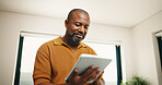 Research, home and black man with tablet for online browsing, network connection or internet. Male person, user or smile with technology, checklist or website for software, update or app in house