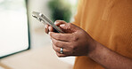 Man, hands and texting with phone in home for communication, network connection or chatting app. Male person, typing or smartphone with internet connectivity for social media or mobile platform