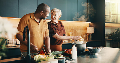 Buy stock photo Meal prep, help or couple in kitchen with love, bonding activity or connection with cooking. Smile, partner or mature people in house with food, happy or culinary hobby in interracial relationship