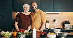 Cooking, portrait or couple in kitchen with love, bonding activity or connection with meal prep. Smile, help or mature people in home with food, happy moment or culinary hobby in healthy relationship