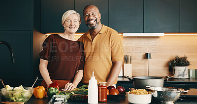 Buy stock photo Cooking, portrait or couple in kitchen with love, bonding activity or connection with meal prep. Smile, help or mature people in home with food, happy or culinary hobby in interracial relationship