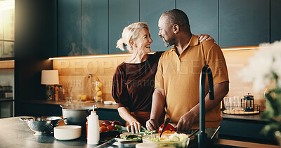 Buy stock photo Cooking, happy or interracial couple in home with help, bonding activity or connection in meal prep. Support, love or mature people with food, caring moment or culinary hobby in healthy relationship.