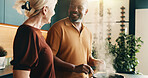 Cooking, support or couple in kitchen with smile, bonding activity or connection in meal prep. Love, partner or mature people in home with food, happy moment or culinary hobby in healthy relationship