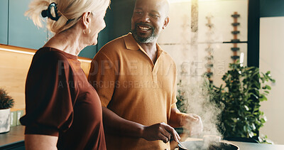 Buy stock photo Cooking, support or couple in kitchen with smile, bonding activity or connection in meal prep. Love, partner or mature people in home with food, happy or culinary hobby in interracial relationship